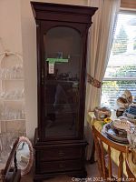 Full exterior view of tall china cabinet showing overall design and finish