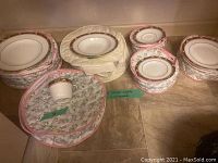 Various pieces in protective fabric covers arranged on floor