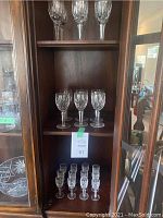 Overview of wine and liqueur glasses displayed on shelving