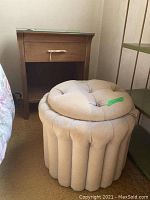 Overall view of nightstand and ottoman side by side, showing size and design