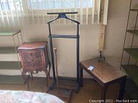 Photo showing all four items: small side table, black clothes stand with shoe scraper, jewelry box table
