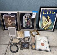 Full lot display with mermaid art prints and assortment of frames