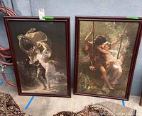 Two framed Renaissance inspired prints: one of a boy and girl on a swing, the other of a couple dancing or embracing