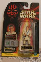 Front view of Star Wars Obi-Wan Kenobi Episode I action figure sealed in original blister packaging. Box shows some minor edge wear but still unopened.
