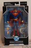 Front view of unopened DC Multiverse Superman action figure in display packaging showing figure and accessories.