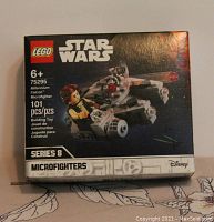 Front of the boxed Lego Star Wars Microfighter set 75295 showing the Millennium Falcon model and Han Solo minifigure art.