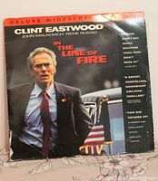 Front cover of the oversized Laserdisc sleeve featuring Clint Eastwood in a suit, with text showing the movie title and actors.