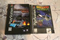 Front cover of Destruction Derby and Shockwave Assault PlayStation 1 game cases on floral surface