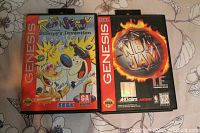 Front view of two Sega Genesis game cases: 'The Ren & Stimpy Show: Stimpy's Invention' and 'NBA Jam'