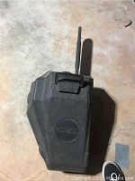 Closed view of the black plastic carrying case with Craftsman logo and handle on top.