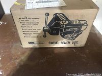 Original Craftsman box showing illustration and features of the swivel bench vise including replaceable hardened steel jaws and pipe jaws.