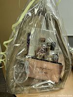 Full view of cellophane‐wrapped basket showing all contents