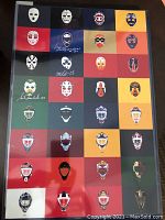 Poster showing 31 illustrated NHL goalie masks in colored grid squares, three signed in white ink.