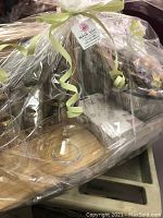 Gift basket wrapped in cellophane showing all items