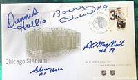 Front side of the Canada Post first day issue envelope with Chicago Stadium image and hockey-themed postage stamp, signed by four hockey legends.