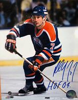 Signed 8x10 color photo of Paul Coffey in Edmonton Oilers hockey gear on ice, signature with 'HOF 04' inscription in blue marker