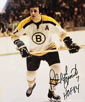Signed 8x10 color photo of Phil Esposito skating with Boston Bruins, signed on front in black ink