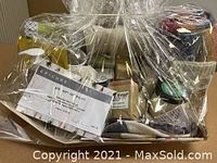 Cellophane-wrapped basket showing wellness products and gift certificate