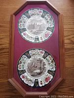 Full view of the two framed Mason’s Ironstone Christmas plates, showing decorative floral and gilded motifs and central scenic imagery.