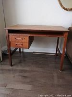 Front view showing two front drawers on left and open shelf beneath top