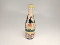 Front view showing the Breton man in traditional clothing with foliage motifs