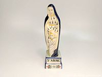 Full front view of the Saint Anne statue, showcasing the entire figure and base with inscription.