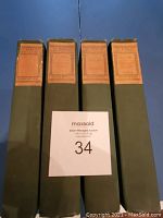 Four volumes of American Orators in green cloth with brown spine labels lined up vertically.