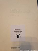 Title page showing 'The Estate of Jacqueline Kennedy Onassis' and auction dates in 1996 with Sotheby's branding and MaxSold auction sticker.