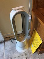 Front view of Dyson bladeless fan standing on tile floor