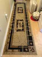 Full-length view of runner on hardwood floor showing overall pattern and edges
