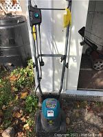 Front view of Yardworks 8A electric lawn tiller showing the handle and power switch assembly.