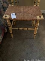 Side view showing leg design and condition with visible scratches.