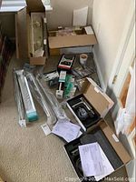 Overview of all items including faucets, grab bars, towel rack, handles and light fixtures on the floor.