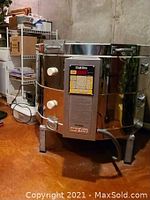 Assembled kiln with control panel and latch closures visible