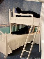 Twin size bunk bed setup showing two single beds perpendicular to each other with ladder section for upper bunk