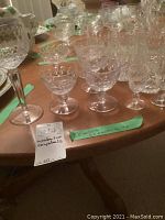Assortment of small and large crystal tumblers with footed glasses