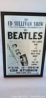 Framed Beatles Ed Sullivan Show print featuring the band and show details.