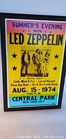 Full view of the framed concert print featuring Led Zeppelin's Summer's Evening concert with supporting acts and event details.