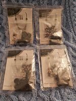 Four sealed jewelry kit crafting sets including earrings, necklace and bracelet, each in separate packaging