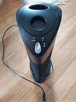 Front top view of the Ionic Pro Compact air purifier showing control panel and one vent.