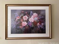 Frontal view of the framed floral art print showing the detailed flower arrangement and gold frame.