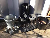 Full lot view showing all items including galvanized pots, plastic pots, glazed pots and planter tray.