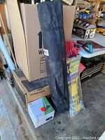 Various items including canopy weight plates, chair, and aircraft spinner