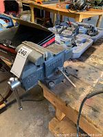 Side view of Craftsman vise mounted on workbench with label showing size 4 1/2 inches.