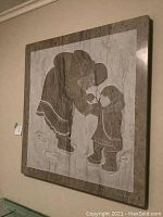 Front view of entire plaque hanging on wall showing overall design and condition