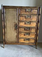 Front view showing six drawers on right and cane-panel door on left