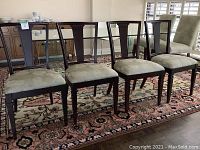 Front view of all four chairs on area rug