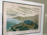 Framed signed silkscreen artwork showing coastal landscape titled 'Dingle'