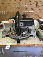 Front view of Black & Decker 12" miter saw showing base and blade guard.
