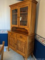 Front view of two-piece solid wood china cabinet